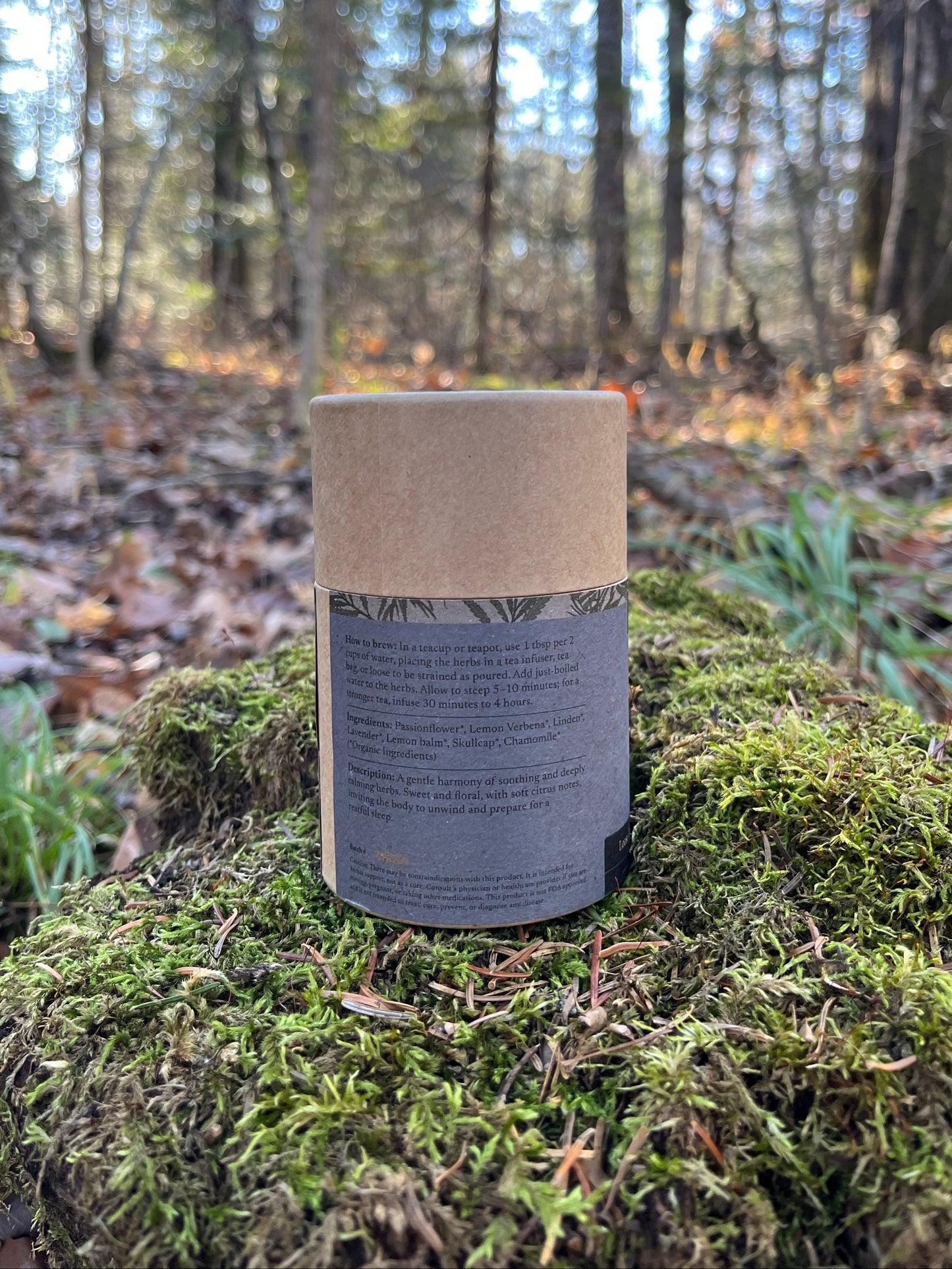 Back of the Counting Sheep tea package on a mossy stump