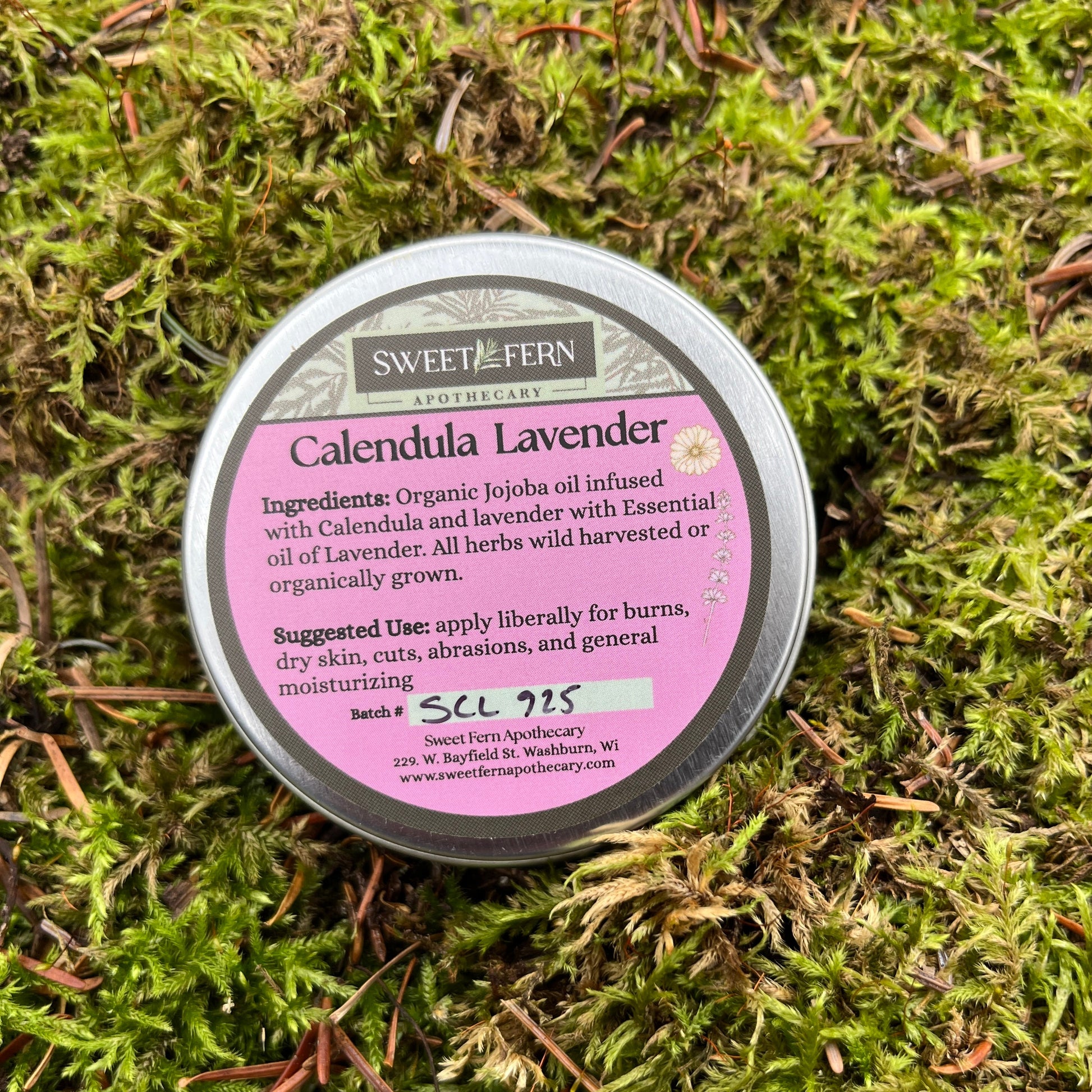 Tin of Sweet Fern Apothecary Calendula Lavender balm on a mossy background