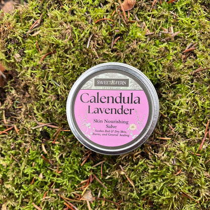 Tin of Calendula Lavender salve on a bed of green moss