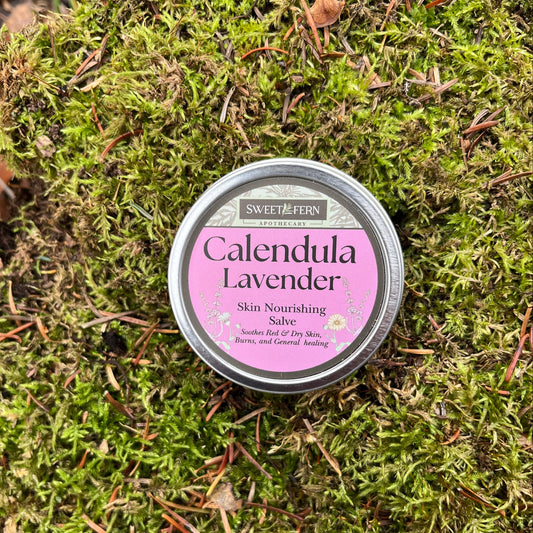 Tin of Calendula Lavender salve on a bed of green moss